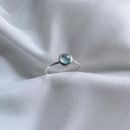 Silver dainty Ring with a pale blue aquamarine set on top