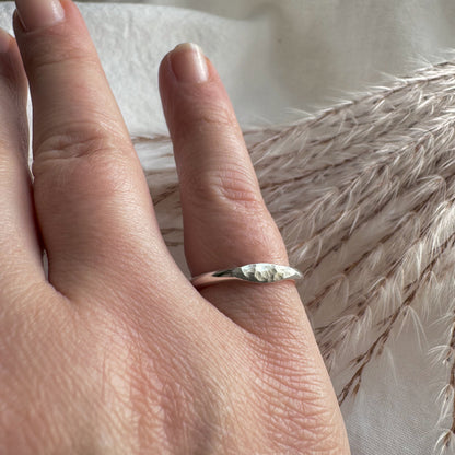 silver hammered mini signet ring worn on the little finger