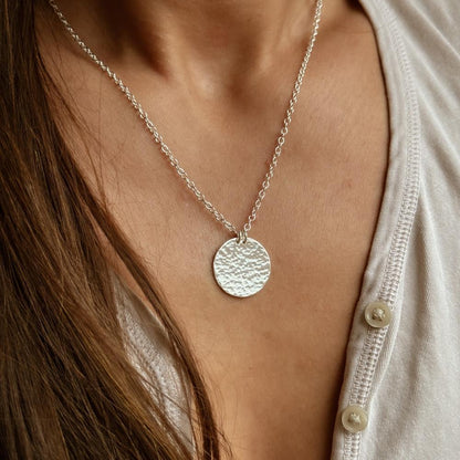 SIlver hammered circle necklace on model