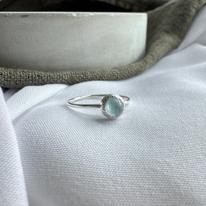 5mm pale blue aquamarine ring set in silver on a hin silver band