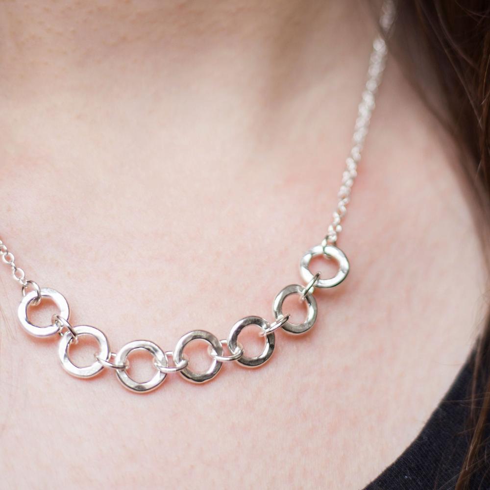 seven silver links necklace worn with a black t-shirt, handmade by Anna Calvert Jewellery