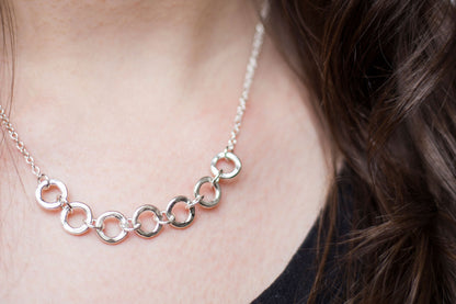seven silver links necklace worn with a black t-shirt, handmade by Anna Calvert Jewellery