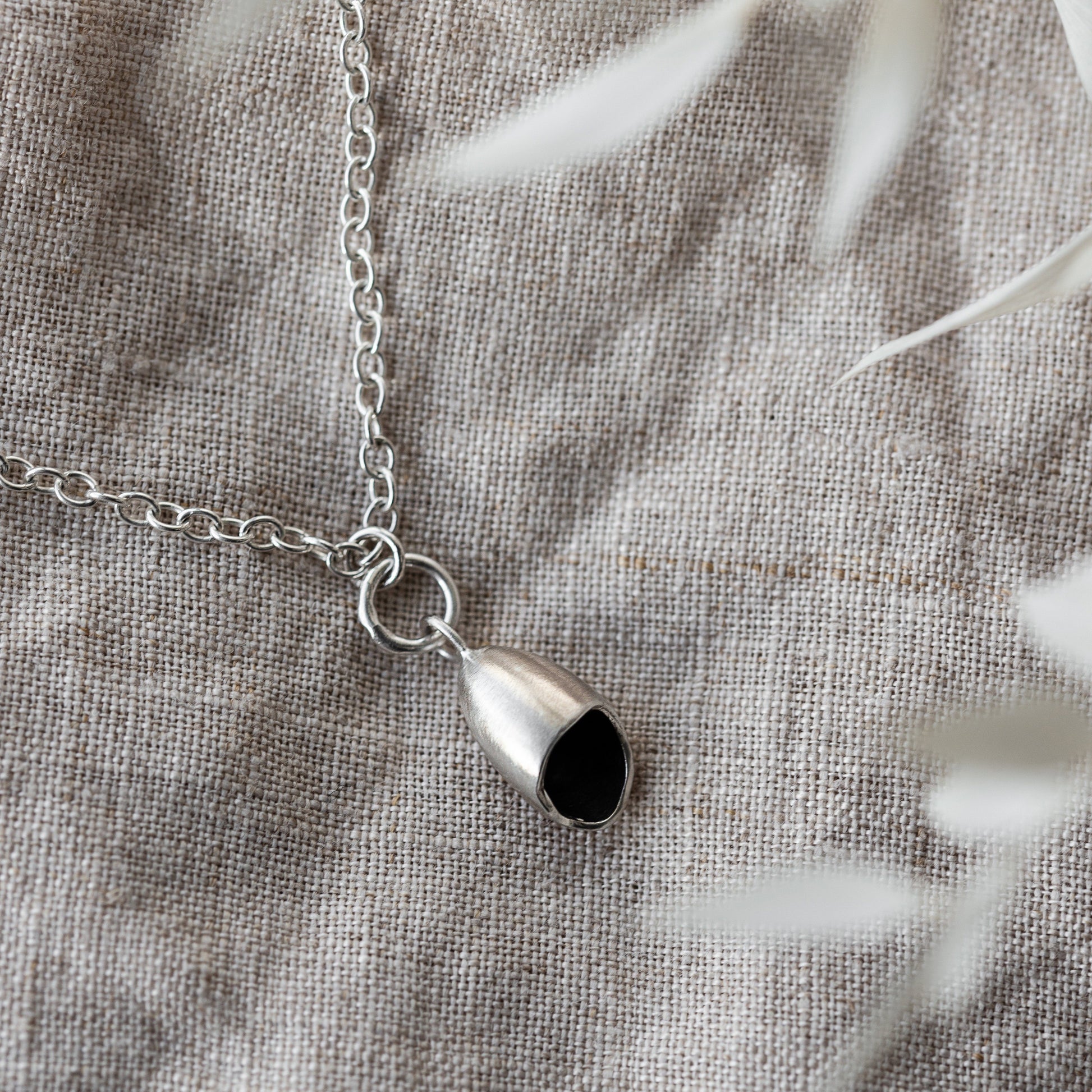 Silver & Black Pod Necklace handmade by Anna Calvert Jewellery 