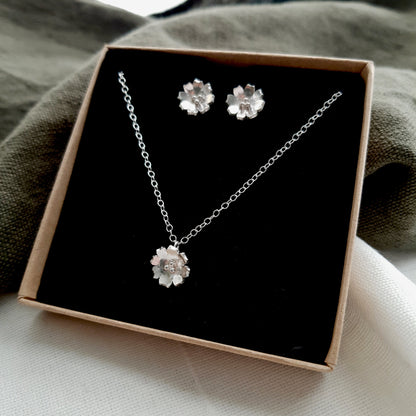 flower earring and necklace gift set displayed in a box with a black insert